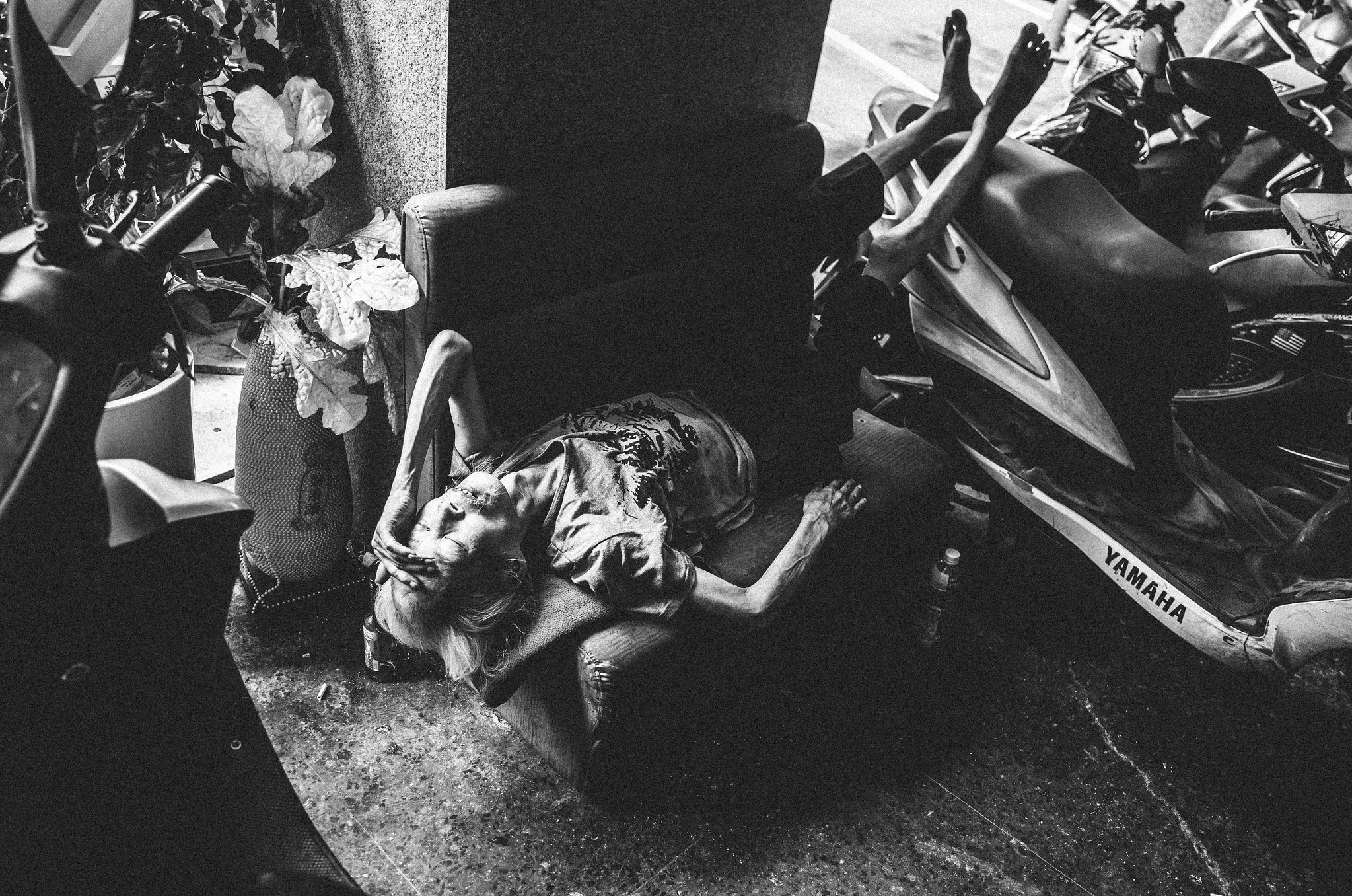 Authentic black and white street photo capturing a fleeting daily life moment in Wanhua, Taipei