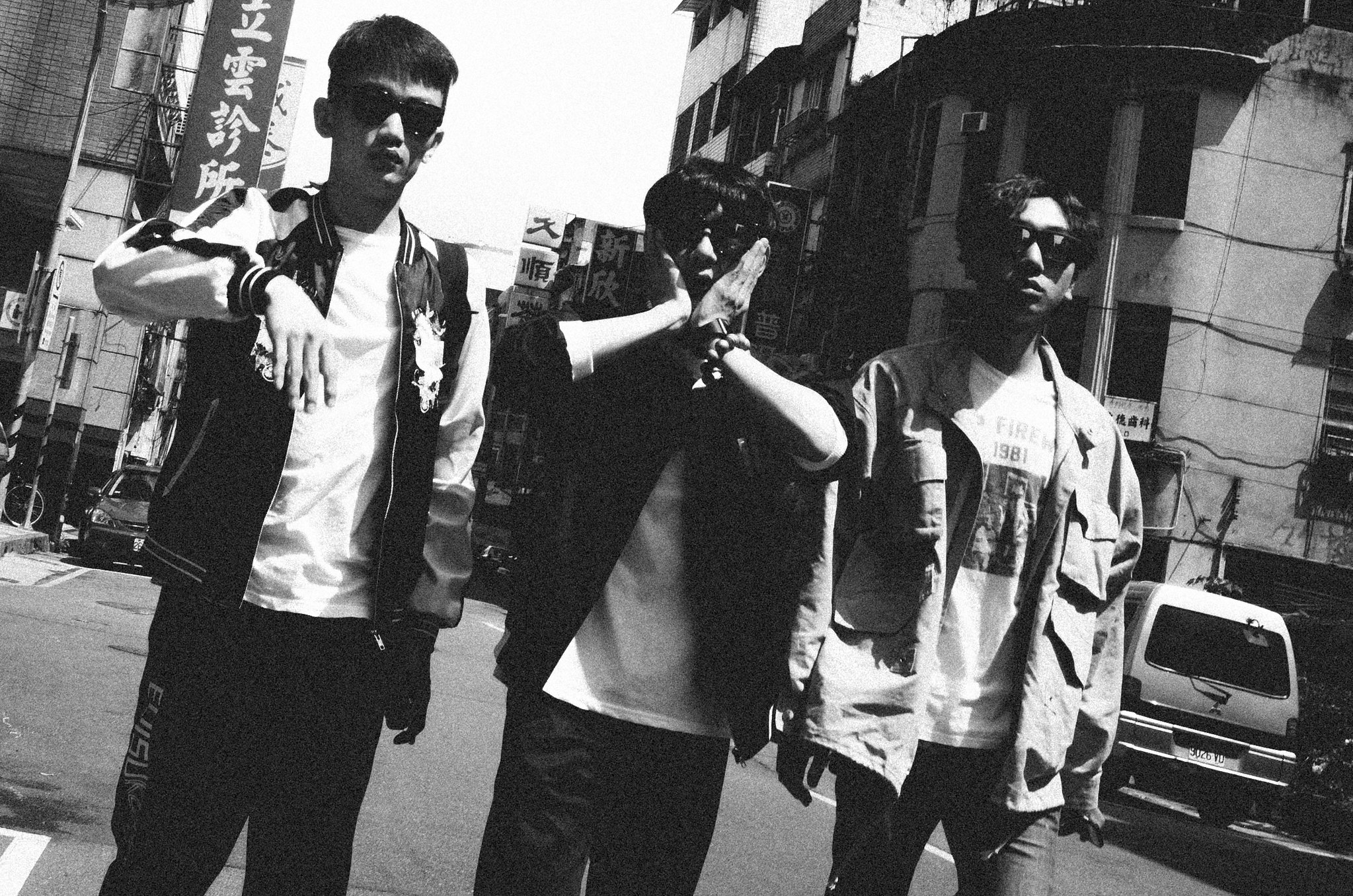 Candid black and white street photograph capturing a local human expression in Wanhua, Taipei